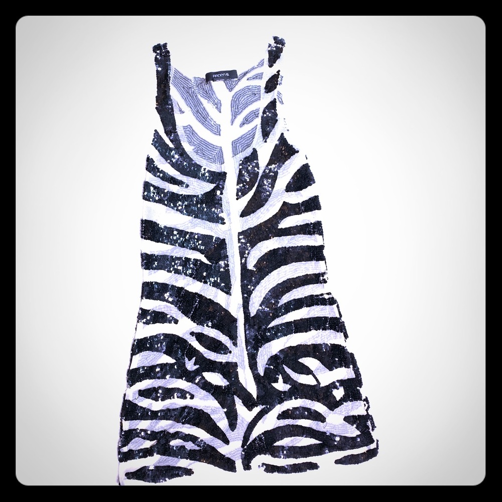 Sheer animal print sequin tunic top